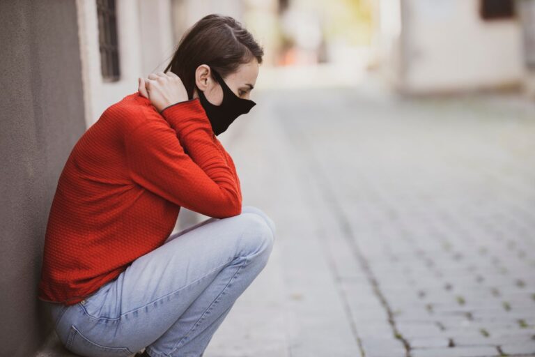 covid-masked woman, panic attack on street